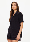 THE UPSIDE women's black Saddle Up Collared Hardy Shirt is made from hemp and cotton blend. The buttoned up shirt features pockets. Designed for comfort.