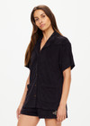 THE UPSIDE women's black Saddle Up Collared Hardy Shirt is made from hemp and cotton blend. The buttoned up shirt features pockets. Designed for comfort.