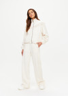 THE UPSIDE women's natural Bow n Arrow Fringe Zip Jacket is made from jacquard. The zip up jacket features elasticated cuffs and hem. Designed for comfort.