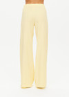 THE UPSIDE women's butter yellow Juliet Low Waist Trackpant is made from a slinky, lightweight fabric and feature side stripes, pockets and a split flared hem.