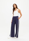 THE UPSIDE women's blue Juliet Pant is made from lyocell and cotton. The low-rise track pants features pockets and elastic waistband. Designed for lifestyle wear.