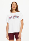 THE UPSIDE women's white Alumni Jodhi Tee is made with organic cotton jersey and is designed with a classic crew neck shape with a logo across the chest.