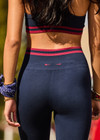 THE UPSIDE women's navy Seamless 25 inch Midi Legging is made from soft and comfortable organic cotton fabric and features a ribbed waistband.