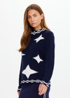 THE UPSIDE women's navy Eternity Clyde boxy Knit Crew Sweater is made with organic cotton and features cream detailing of stars and moons.