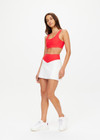 THE UPSIDE women's red Pacific Harley Scoop Neck Bra is made from recycled peached. The supportive sports bra features removable cups. Designed for yoga, pilates and barre.