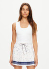 THE UPSIDE women's white Kori Scoop Neck Crop Tank is made from recycled peached. The high coverage sports tank top features removable cups. Designed for yoga, pilates and barre.