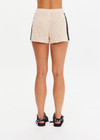 THE UPSIDE women's natural Luminary Crochet Hali Short is made from cotton. The side stripe short features drawstring at waist. Designed for travel and holiday.
