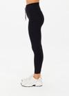 THE UPSIDE women's Peached 25 Inch Pocket legging is a mid rise 7/8 length leg in black with side pockets and a stretch drawcord waistband. The fabric is breathable and quick drying.