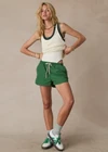 THE UPSIDE women's green Tennis in Bahamas Run Short is a mid rise short with a drawstring. Designed for running and exercise.
