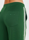 THE UPSIDE women's green When in Roma Holiday Pant is made from recycled fabric. The high waisted side stripe pant features splits at hem. Designed for comfort.