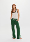 THE UPSIDE women's green When in Roma Holiday Pant is made from recycled fabric. The high waisted side stripe pant features splits at hem. Designed for comfort.