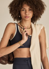 THE UPSIDE women's navy Silverstone Harley Scoop Sports Bra is designed for a supportive fit featuring a recycled rib fabrication and removable bust cups. Ideal for yoga and pilates.
