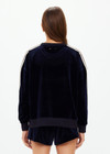 THE UPSIDE women's navy Monaco Lisel Crew Neck Sweater is a soft recycled velour fabric in a relaxed fit with a dropped shoulder. The perfect travel or everyday piece.