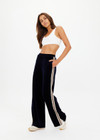 THE UPSIDE women's navy Monaco Freya Wide Leg Pant is a soft recycled velour fabric with side seam pockets and an elasticated waistband. The perfect travel pant.