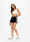 THE UPSIDE women's navy Monaco Helena Short features a soft recycled velour fabric in a relaxed short shape with elasticated wasitband. The perfect travel piece.