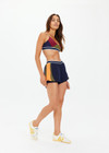 THE UPSIDE women's multicoloured recycled peached Starburst Georgie Scoop Sports Bra is designed for a supportive fit and features removable cups. Made for yoga and pilates.