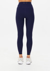 THE UPSIDE women's navy recycled peached Daytona 25 inch Legging is designed for a high-rise supportive fit and features contrast cream binds. Perfect for yoga.
