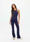 THE UPSIDE women's navy organic cotton Asher Racerback Tank Top is designed for a slim fit and features a racerback shape and high neckline. Ideal for layering & pilates.