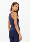 THE UPSIDE women's navy organic cotton Asher Racerback Tank Top is designed for a slim fit and features a racerback shape and high neckline. Ideal for layering & pilates.