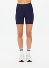 THE UPSIDE women's navy Silverstone 5 Inch Spin Short is a recycled textured rib fabrication with moisture wicking properties. Made for a soft & supportive fit in yoga and pilates.
