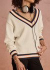 THE UPSIDE women's white organic cotton Josette V Neck Knit Sweater features a striped cable neckline in orange and navy. Made for everyday leisure.