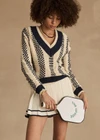 THE UPSIDE women's creme Cadiz Pleated Knit Skirt features an elasticated waistband with navy contrast knitted stripes. Perfect for tennis.