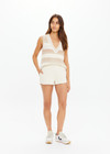 THE UPSIDE women's creme organic cotton Hamilton Dee Short is designed for a regular fit, featuring a elasticated waistband with side seam pockets. Made for everyday.