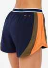 THE UPSIDE women's navy recycled fabric Starburst Lucky Run Short is designed for a true to size fit with invisible side zip pockets. Made for running.