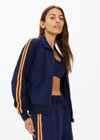 THE UPSIDE women's navy Vitesse Pari Zip Jacket comes in a slinky fabrication with mesh side tapes in contrast orange and side pockets. Designed for everyday leisure.