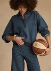 THE UPSIDE women's blue organic cotton Lumiere Zane Knit Collared Top is designed for a relaxed fit and features a geometric star design. Made for lifestyle.