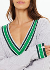 THE UPSIDE women's grey marle organic cotton Josette V Neck Knit Sweater is a regular fit and features cable detailing through front and a green striped neckline. Made for lifestyle.