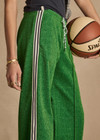 THE UPSIDE women's green Galaxia Loretta Pant is designed for a mid to low rise straight leg fit and features elasticated waistband, drawcord and side seam pockets. Made for lifestyle.