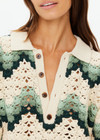 THE UPSIDE women's green organic cotton Tidal Sagra Crochet Shirt is designed for a relaxed fit and features tortoiseshell buttons at opening. The perfect vacation piece.