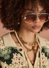 THE UPSIDE women's green organic cotton Tidal Sagra Crochet Shirt is designed for a relaxed fit and features tortoiseshell buttons at opening. The perfect vacation piece.