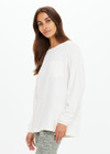 THE UPSIDE women's cream recycled cotton Soho Cara Long Sleeve Top is designed for a relaxed fit and features a ribbed neck and cuffs and a patch pocket at front. Made for everyday leisure.