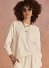 THE UPSIDE women's cream recycled cotton Soho Cara Long Sleeve Top is designed for a relaxed fit and features a ribbed neck and cuffs and a patch pocket at front. Made for everyday leisure.