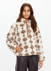 THE UPSIDE women's beige recycled fleece fabrication Harlow Fleece Pullover is a relaxed pullover style with quarter zip through and zip pockets.