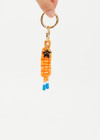 THE UPSIDE women's Orange Limitless Keyring charm with gold metal star and macrame paracord in bright orange with rubber dipped ends.
