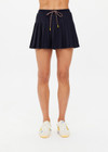 THE UPSIDE women's navy pinstripe merino Wool Cadiz Pleated Skirt features an inner short and pockets with elasticated waistband. Perfect for tennis and pickleball.
