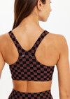 THE UPSIDE women's recycled peached black and chocolate check Technica Jade Bra is a full coverage sports bra with extra support and includes removable cups. Perfect for yoga, pilates & barre.