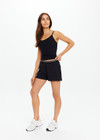 THE UPSIDE women's Black recycled peached Tani Scoop Tank Top features fine elasticated straps with inner shelf bra and removable cups. The perfect wardrobe staple.