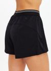 THE UPSIDE women's black Lucky Run Short features a elasticated waistband, a slightly curved hem, internal inner short for full coverage and invisble zip pockets. Made for running.