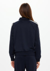 THE UPSIDE women's black Empire Pari Zip Jacket fits true-to-size and features a zip-through opening and knitted cream stripes down sides with a hint of silver metallic. Made for lifestyle.