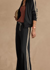 THE UPSIDE women's black Empire Marnie Wide Leg Pant is high-waisted and features a elasticated waistband with drawcord and side pockets. Made for lifestyle.