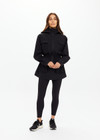 THE UPSIDE women's black Freddie Fleece Lined Anorak is made from bonded water resistant fabric with internal warm polar fleece and features external pockets with flap closure and drawcord with toggles to cinch in waist.