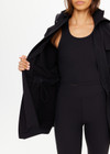 THE UPSIDE women's black Freddie Fleece Lined Anorak is made from bonded water resistant fabric with internal warm polar fleece and features external pockets with flap closure and drawcord with toggles to cinch in waist.