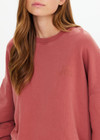 THE UPSIDE women’s red organic cotton Serendipity Paloma Crew is designed for a boxy fit and features drop shoulders and The Upside logo puff printed at the front. Made for everyday.