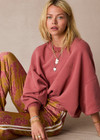 THE UPSIDE women’s red organic cotton Serendipity Paloma Crew is designed for a boxy fit and features drop shoulders and The Upside logo puff printed at the front. Made for everyday.