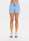 THE UPSIDE women’s blue recycled Era Short is designed to be mid rise, featuring a striped elastic drawcord and inner mesh brief in white. Made for running.
