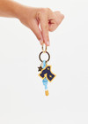 THE UPSIDE multi Seven Keyring with gold metal star and macrame paracord in palme blue and white with rubber dipped ends.